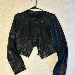 Free people cropped leather jacket with zippers.